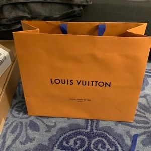 Louis Vuitton shopping bag and two envelopes